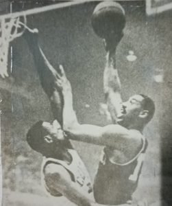 Wilt Chamberlain tries a short hook over the outstretched arm of arch nemesis Bill Russell during their fierce NBA rivalry in the 1950s and 1960s.