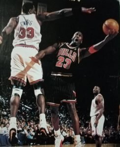 Michael Jordan eyes the basket against New York mastodon Patrick Ewing.