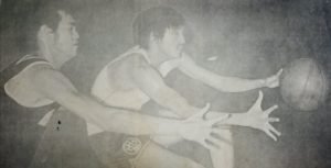 Ramon (Gene) Lucindo and Atoy Co chase the loose leather during the 1973 MICAA All-Filipino title series between eventual champion Mariwasa and Crispa-Floro.
