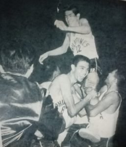 Second-year national teamer Danilo Florencio is hoisted by Jimmy Mariano and other teammates after the game in which the former UST ace came off the bench to score four crucial points in the last 48 seconds and lift the Filipinos to victory against host South Korea in the finals of the 1967 ABC competitions.