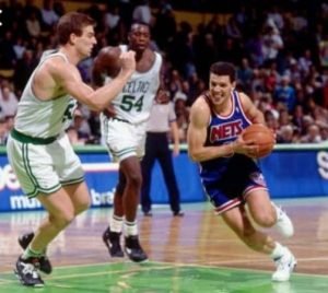 Nets guard Drazen Petrovic navigates around his Boston Celtics defender.