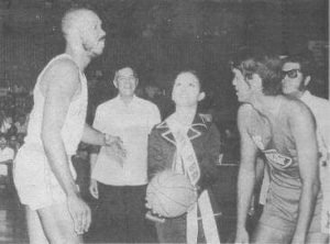 On April 9, 1975, the first game ever in PBA history was held at the Araneta Coliseum. Here, Noritake's Israel Oliver and Concepcion Carrier's Ramon Lucindo await the ceremonial opening toss as PBA commissioner Leo Prieto and PBA president Emerson Coseteng look on.