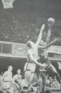 Celtics great Bill Russell hoists a left-handed hook over a St. Louis (now Atlanta) Hawks defender.