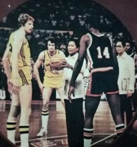 Then-Philippine president Ferdinand Marcos is all set for the ceremonial toss between the United States and Australia to usher in the 1978 World Basketball Championship before a crowd of 10,000 at 32,000-seat Araneta Coliseum.