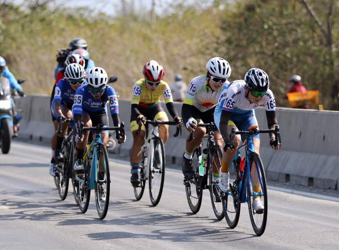 MHAY ANN LINDA (second from right) rides ahead of teammate Kate Yasmin Velasco in a six-rider breakaway in Stage 7.