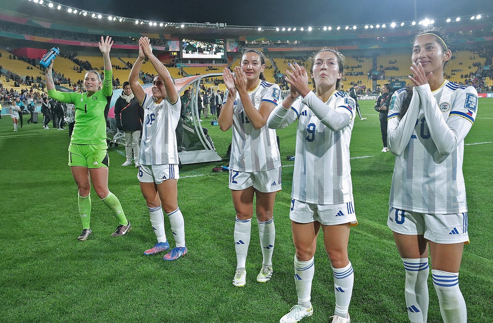 Goalie Olivia McDaniel (left) leads the other Filipinas in saluting the crowd after their upset of the Ferns. With her are: Sofia Harrison (second from left), Ryley Bugay, Isabella Flanigan and Quinley Quezada. [contributed photo]