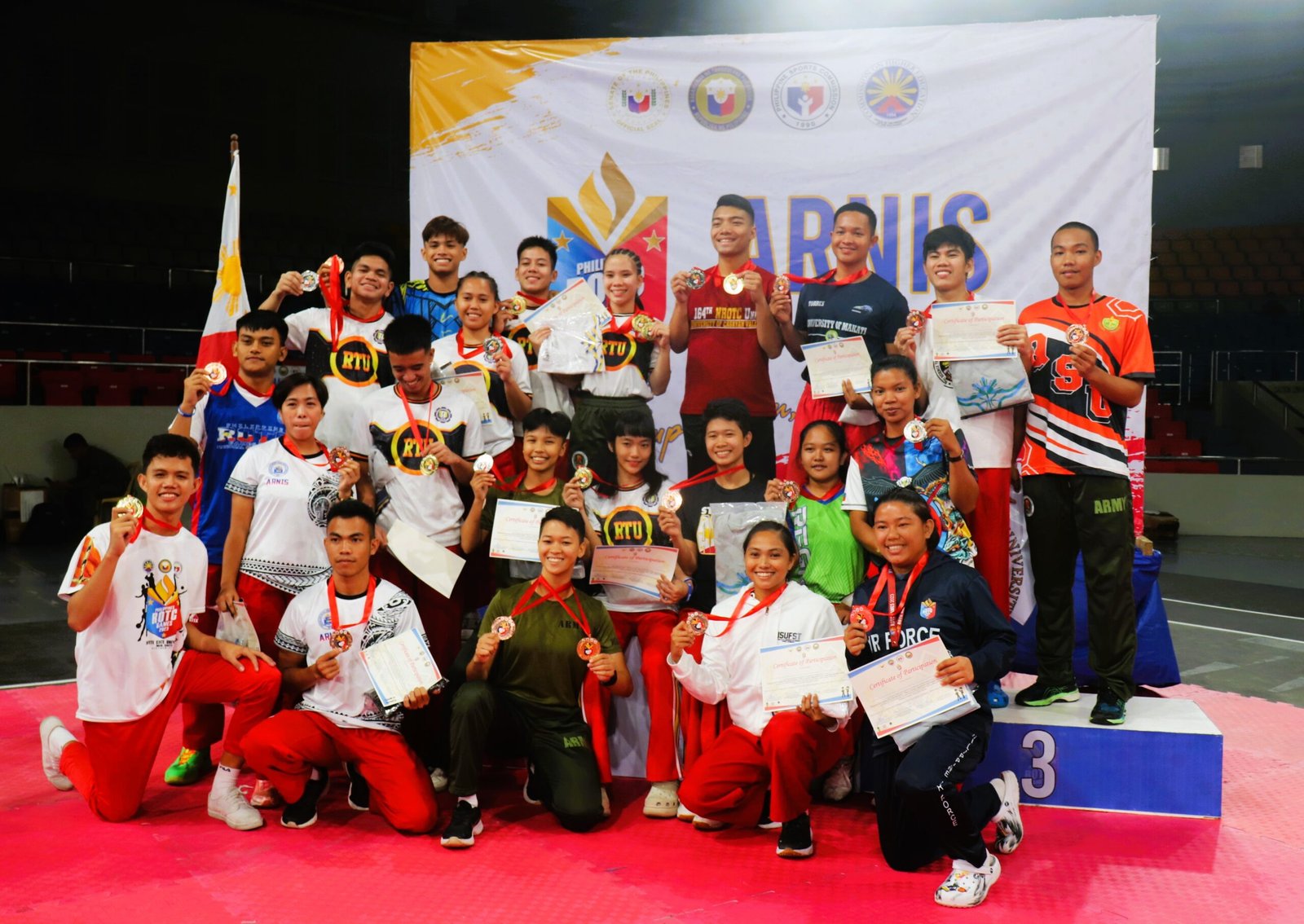 Arnis awardees gather for a photo opportunity during its awarding ceremonies at the Ninoy Aquino Stadium in 2023 Philippine ROTC Games - National Championships. [PSC media pool photo]