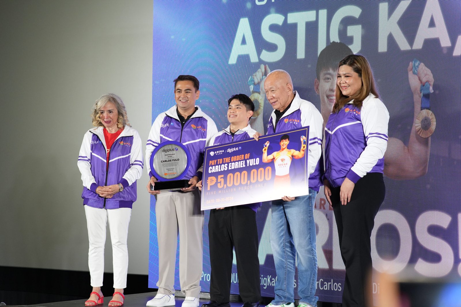 Left to right: Gymnastics Association of the Philippines President Cynthia Carrion, DigiPlus Head of Offline Operations Jasper Vicencio, double Olympic gold medalist and ArenaPlus brand ambassador Carlos Yulo, DigiPlus Chairman Eusebio Tanco, and DigiPlus Vice President Celeste Jovenir after Yulo received his P5 million cash reward at the recent DigiPlus Astig Ka, Carlos! press conference.