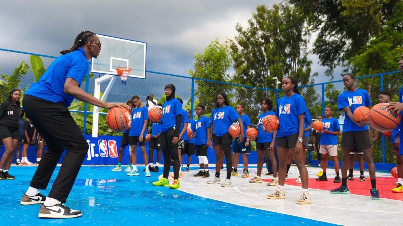 Children participate in a Jr. NBA clinic at the newly unveiled Loiswell Academy court