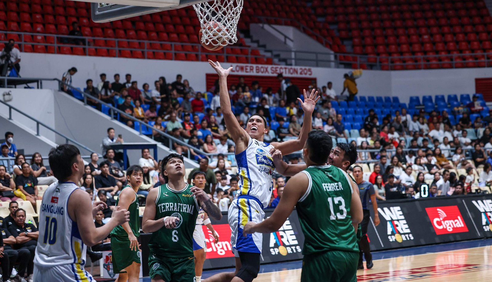 Zav Lucero drives hard to the rim as Magnolia dominates Terrafirma in Antipolo. [PBA Images]