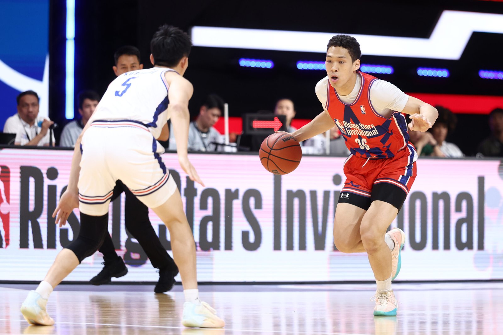 Fast break play in progress during the boys’ semi-final between Yongsan High School and Fukuoka Ohori Senior High School. [photo credit: NBA Rising Stars Invitational]
