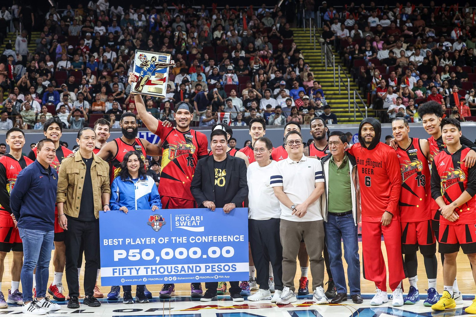 June Mar Fajardo hoists his 12th Best Player of the Conference trophy before Game 4 at MOA Arena. [PBA Images]