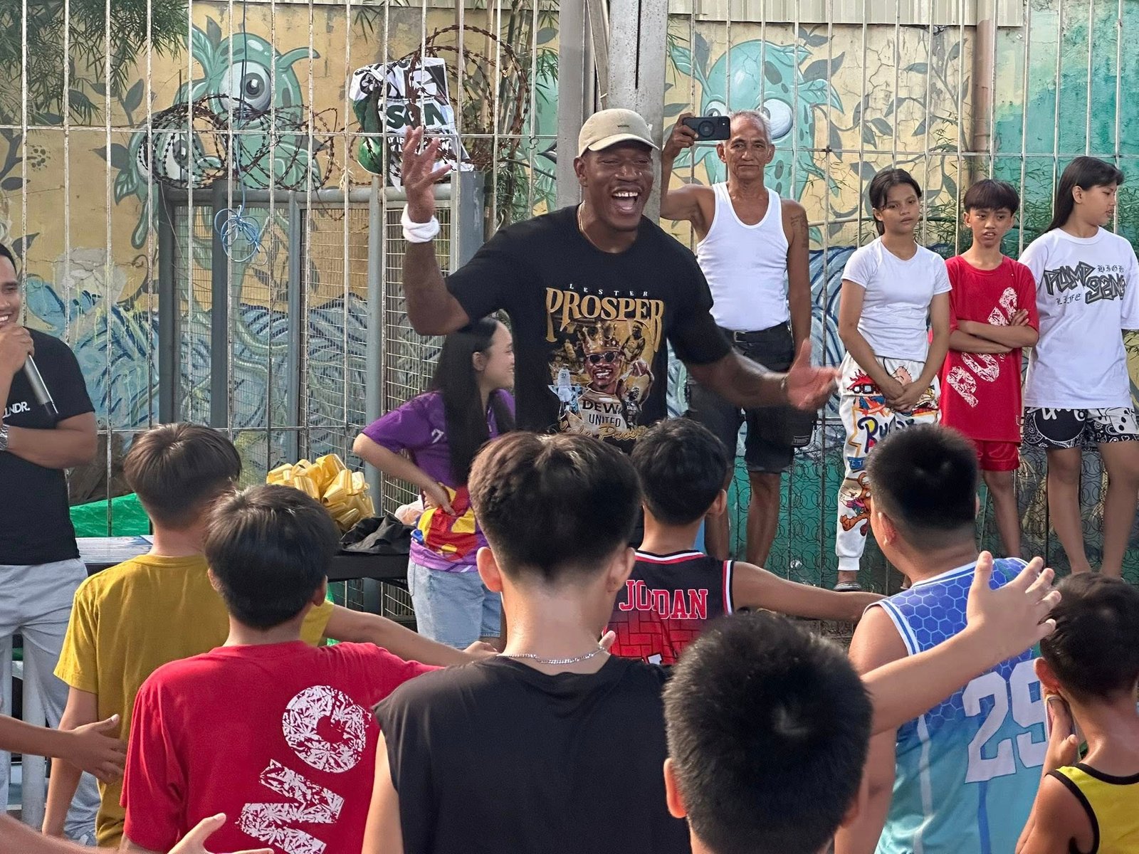 Lester Prosper leads the kids in attendance at his outreach in basketball drills in Pandacan, Manila on Tuesday, August 19, 2025. [photo credit: Brian Yalung]