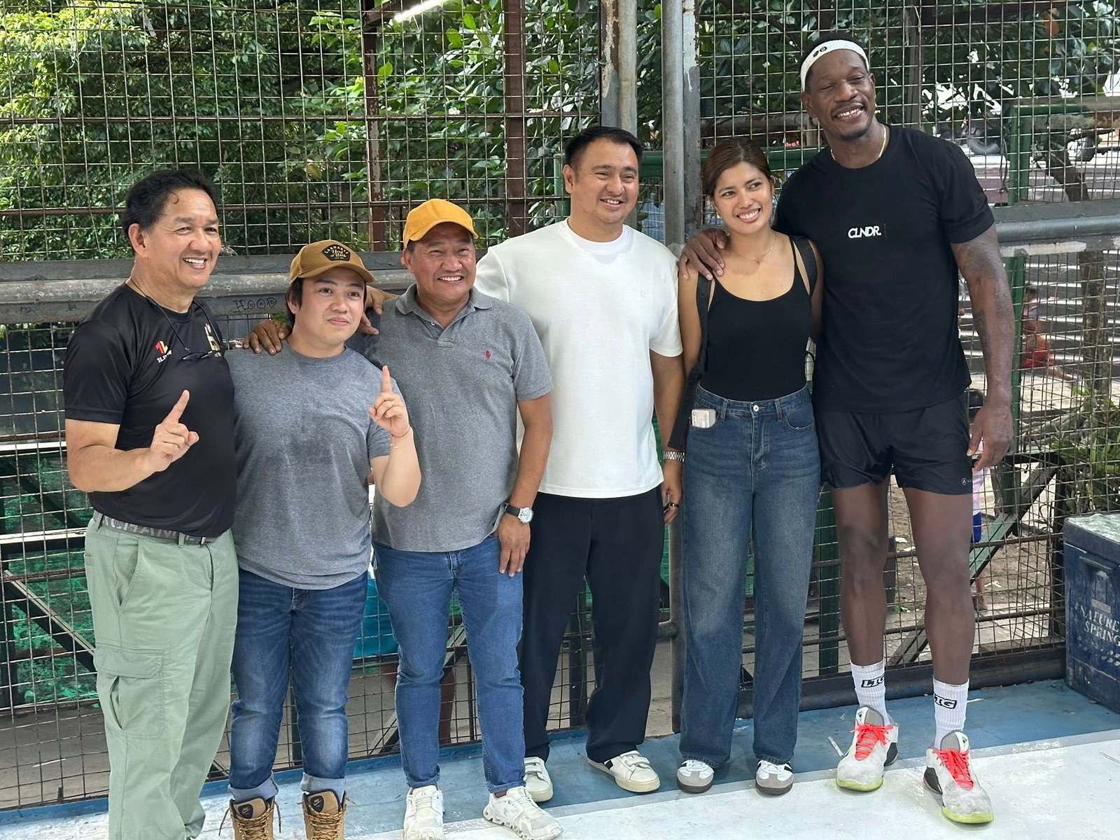 Lester Prosper with Manila officials, Ireneo Bautista and volleyball player Joy Dacoron post for a photo at the former PBA import's outreach program in Pandacan, Manila on August 19, 2025. [photo credit: Brian Yalung]