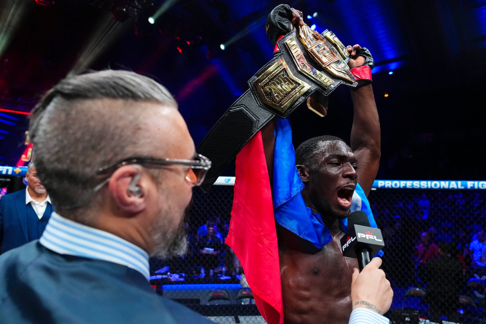 Thad Jean raises the PFL welterweight belt after a five-round victory over Logan Storley in Atlantic City. [PFL photo]