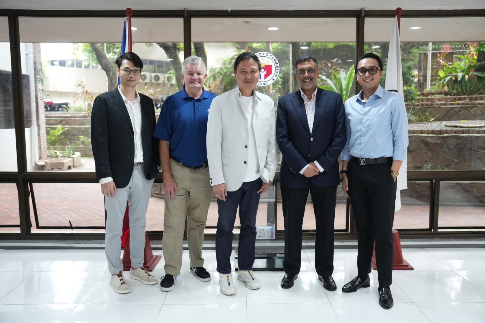 PSC Chairman Patrick Gregorio (center) pledged his full backing for the upcoming Manila leg of the International Series during a courtesy visit on Tuesday by key tournament officials (L-R): Jordan Lam, Tournament Director Pat Janssen, International Series Head Rahul Singh, and Migs Almeda. [PSC photo]