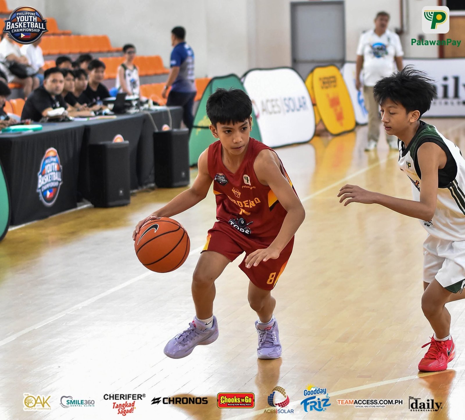 Tobby Mordeno drives to the basket for Tops Mordeno in their first U13 win.