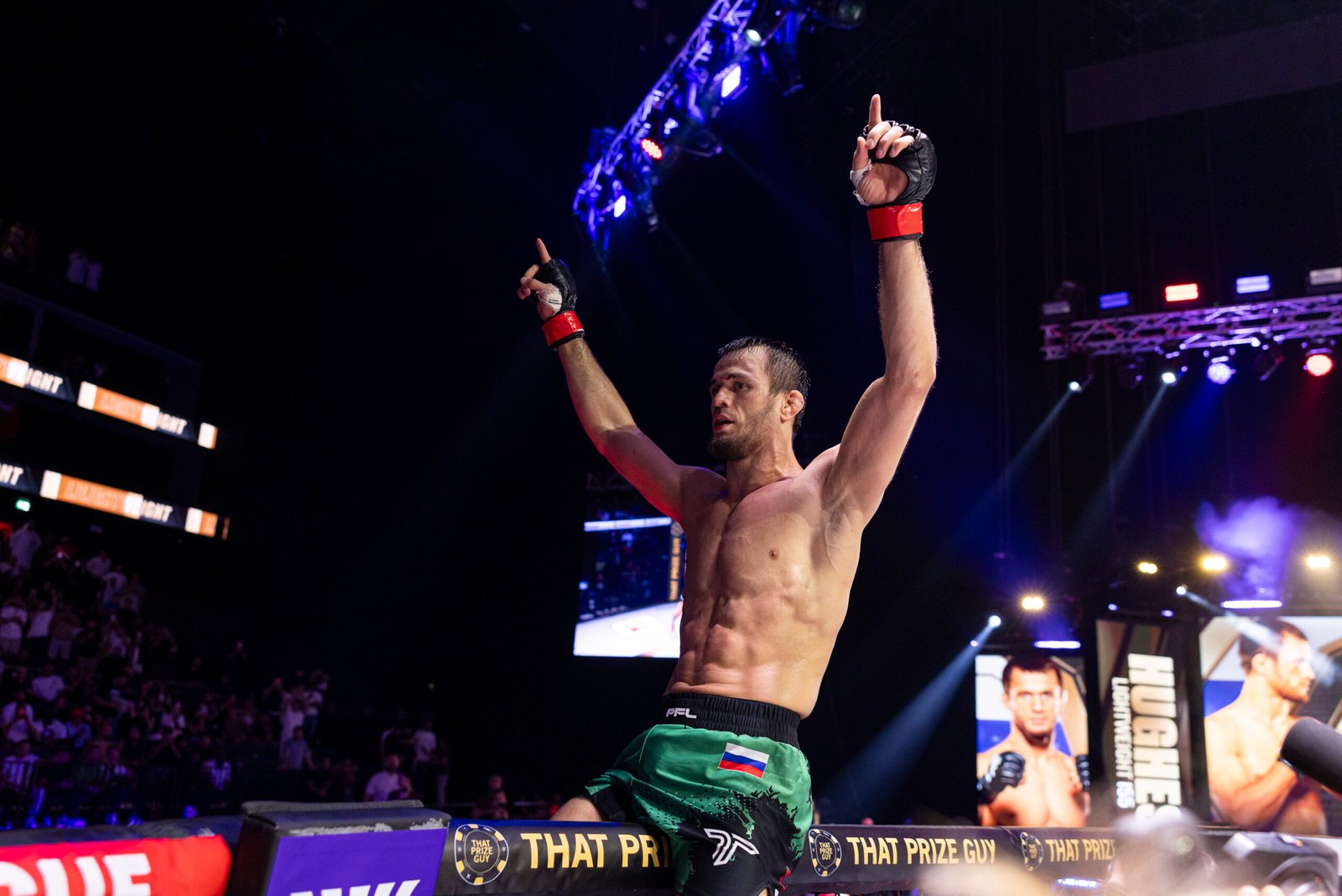 Usman Nurmagomedov celebrates after defending his undefeated record in Dubai.