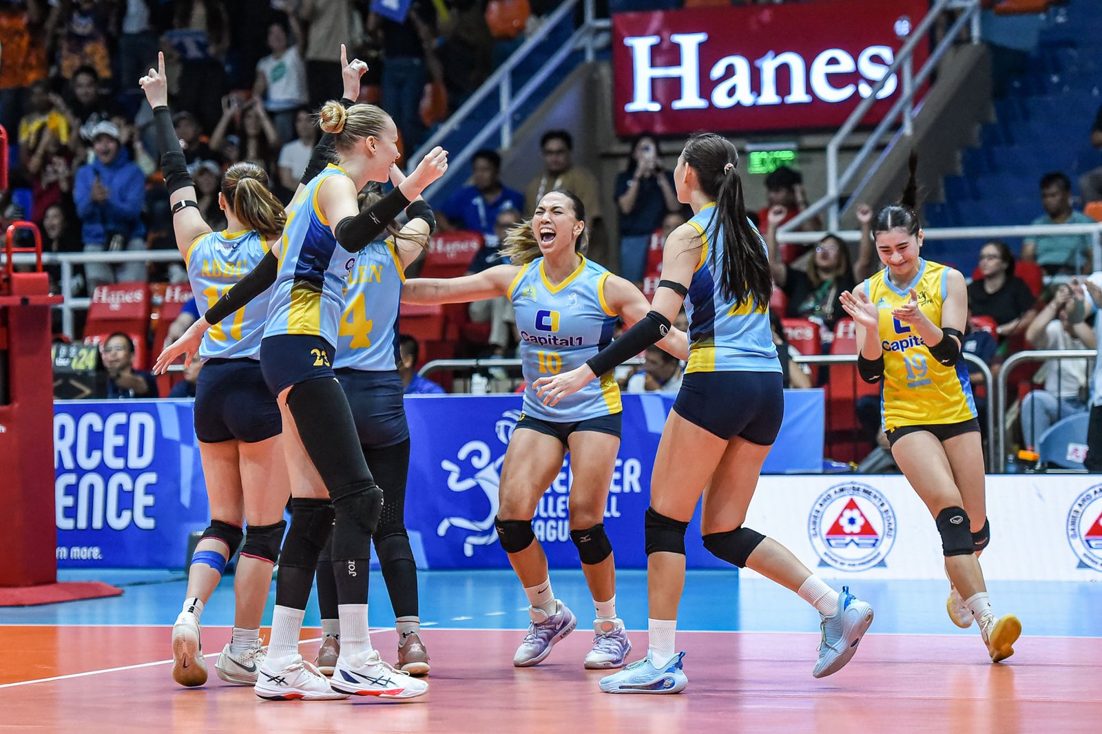 Capital1 Solar Spikers celebrate a straight-sets win over Cignal Super Spikers. [PVL Images]