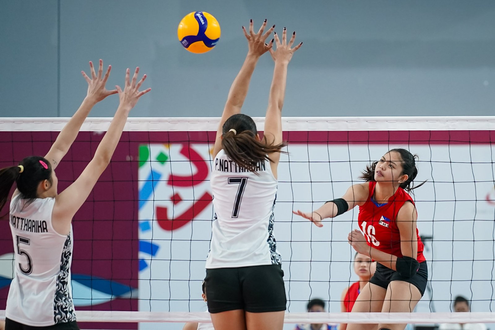 Rhose Almendralejo (16) sees action for the Philippine girls' volleyball team in the bronze medal match. [POC photo]