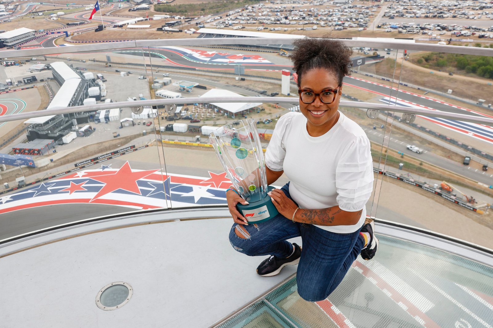 Girlstart receives the F1 Allwyn Global Community Award trophy during the US Grand Prix weekend in Austin.