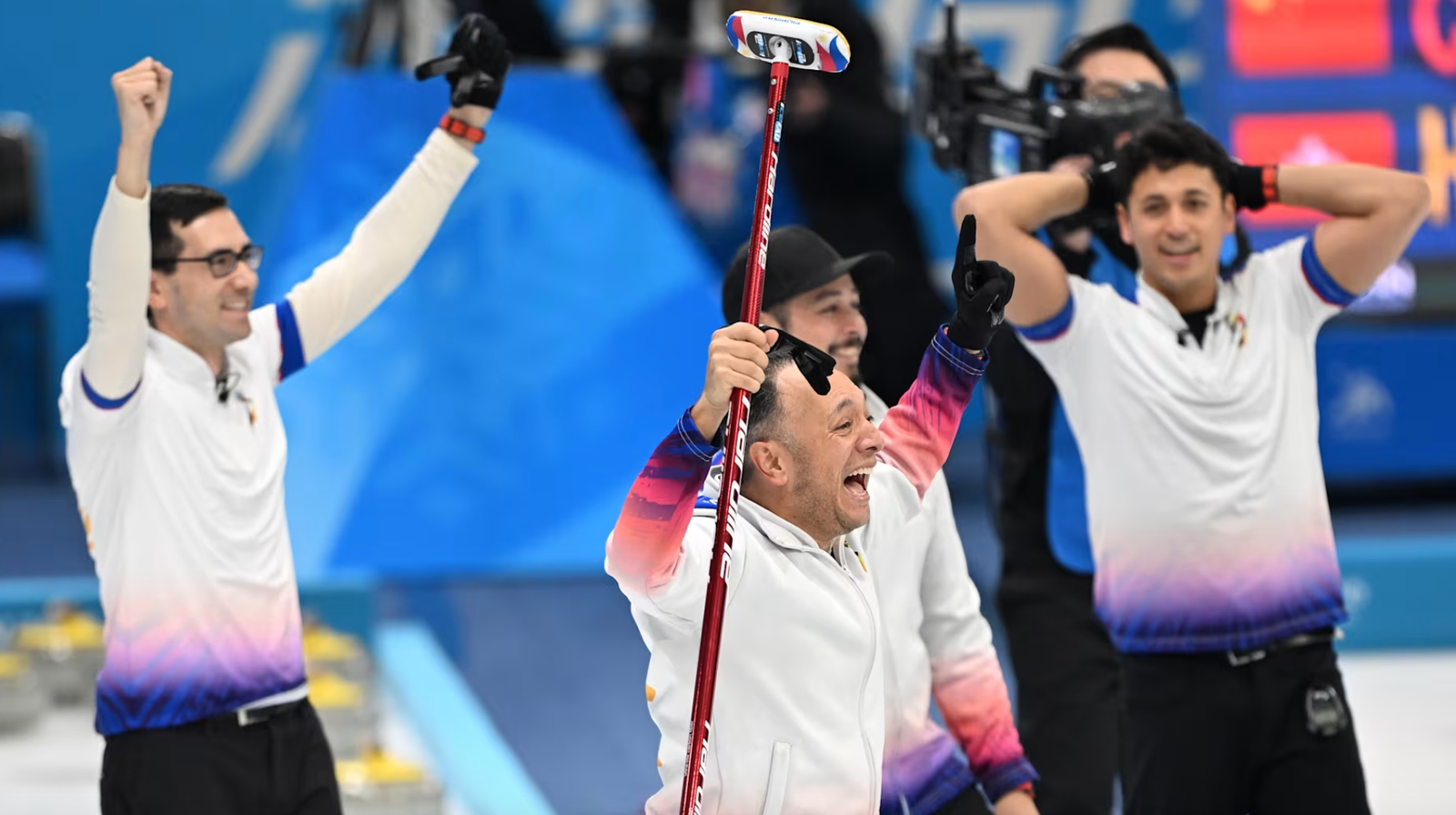 The Philippine curling team celebrate after their gold medal-clinching victory at the Harbin Asian Winter Games last February. [Photo credit: Olympics.com]