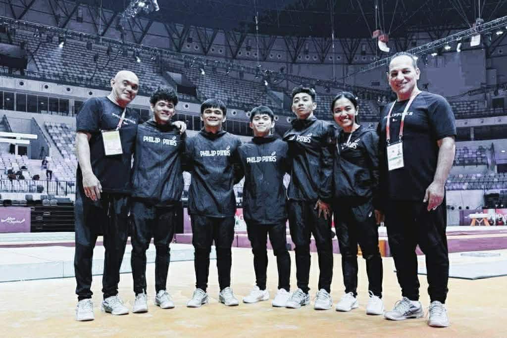 Australian coach Nedal Alyousef (right), with the national men’s gymnastics squad at the last world championships in Jakarta, Indonesia, sees the world juniors as a big boost for the development of local gymnastics. [PSC photo]