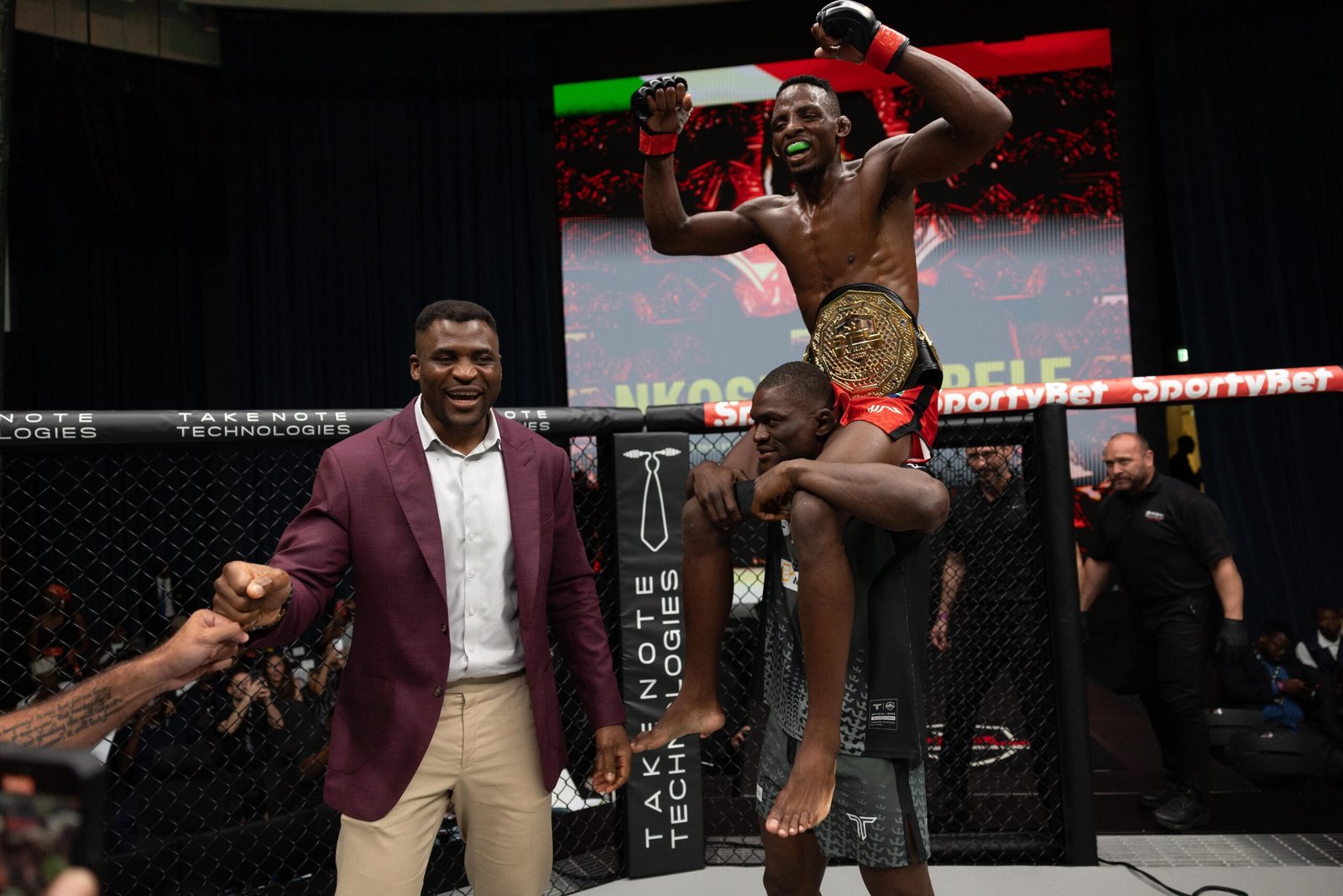 Nkosi Ndebele celebrates after capturing the inaugural PFL Africa Bantamweight title. [PFL photo]