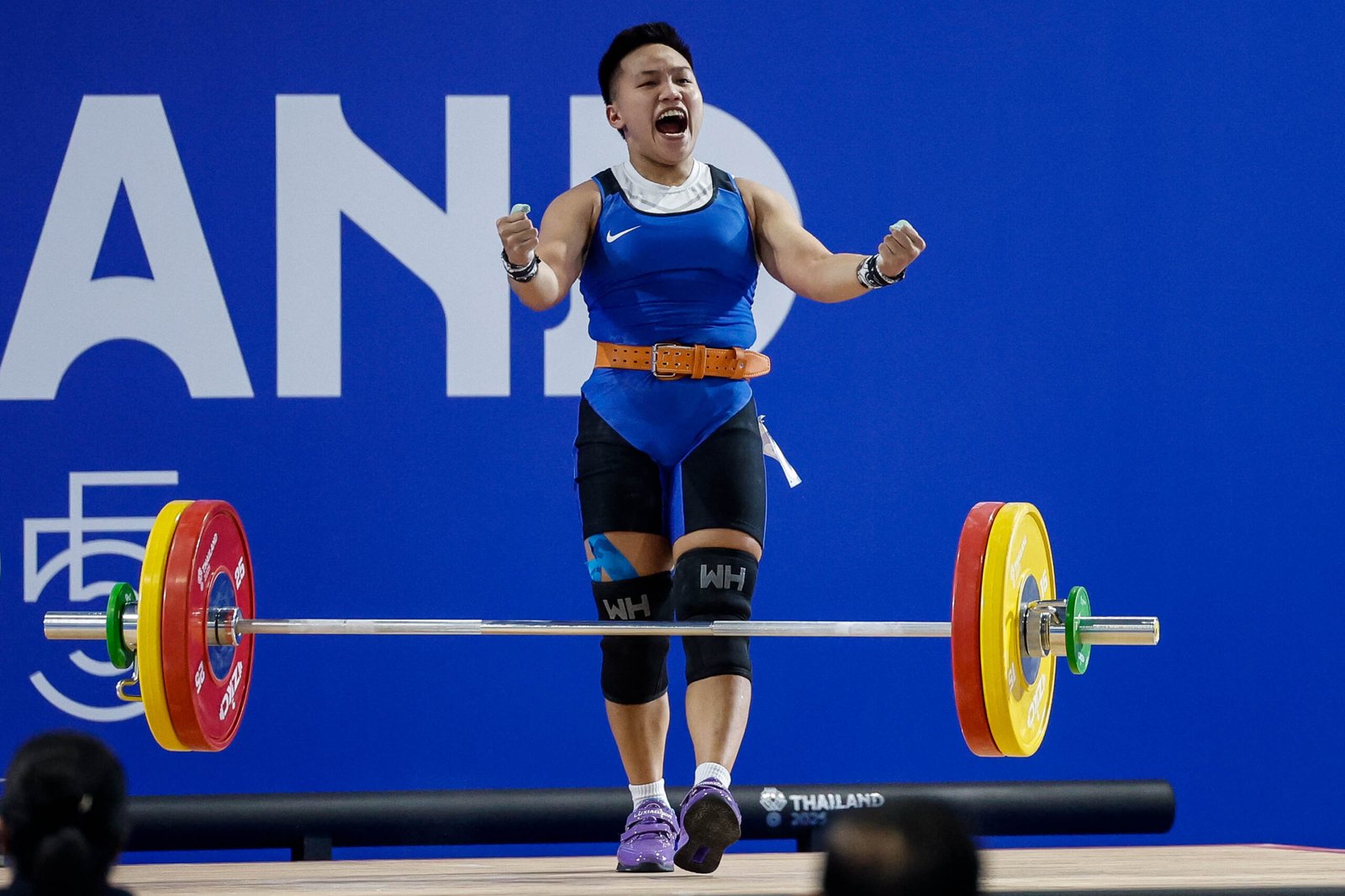 Ando celebrates securing the Philippines’ first gold medal in weightlifting. [POC Media pool]