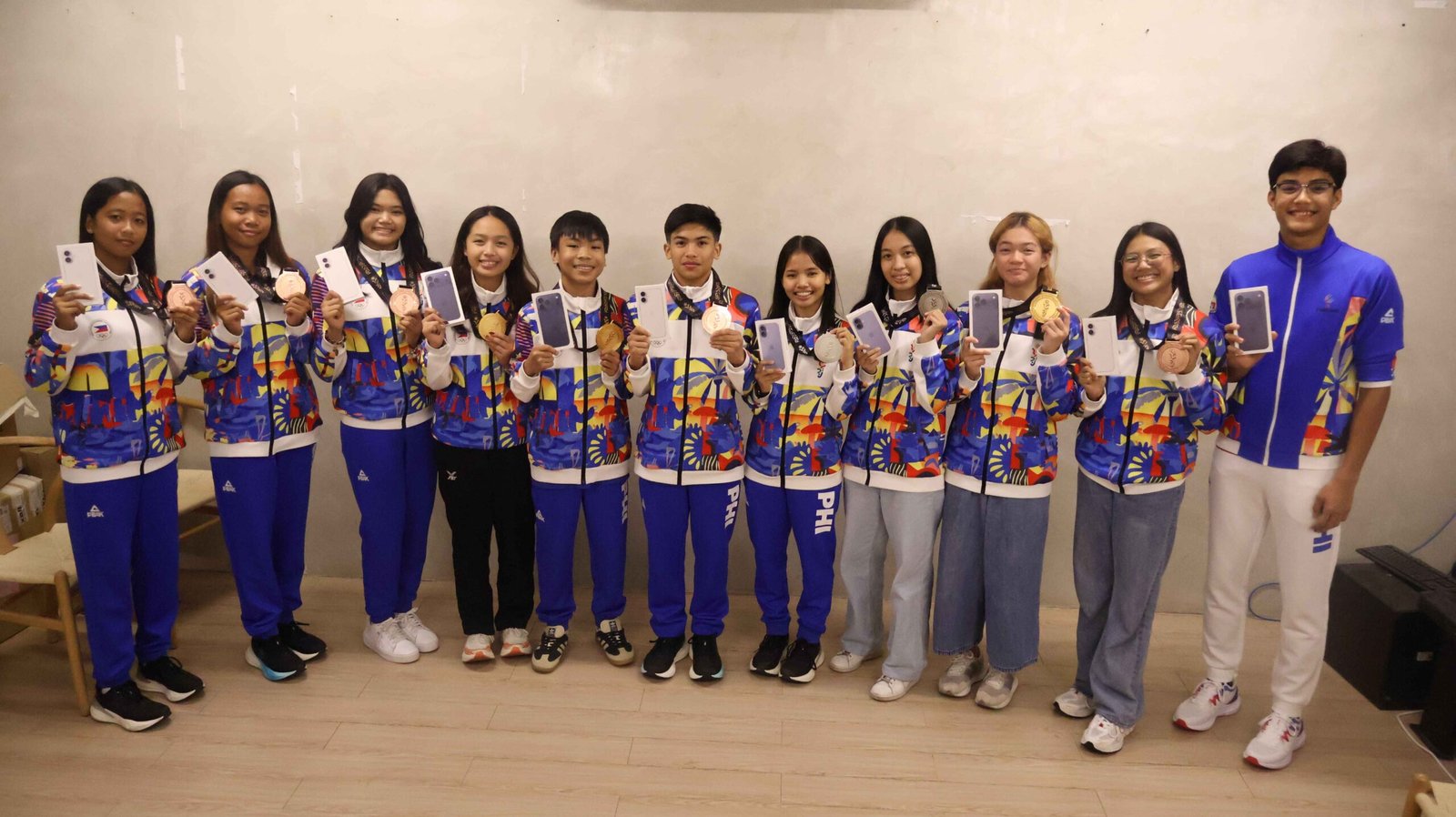 Athletes pose with their awards as SportsPlus reaffirms long-term support for grassroots programs.