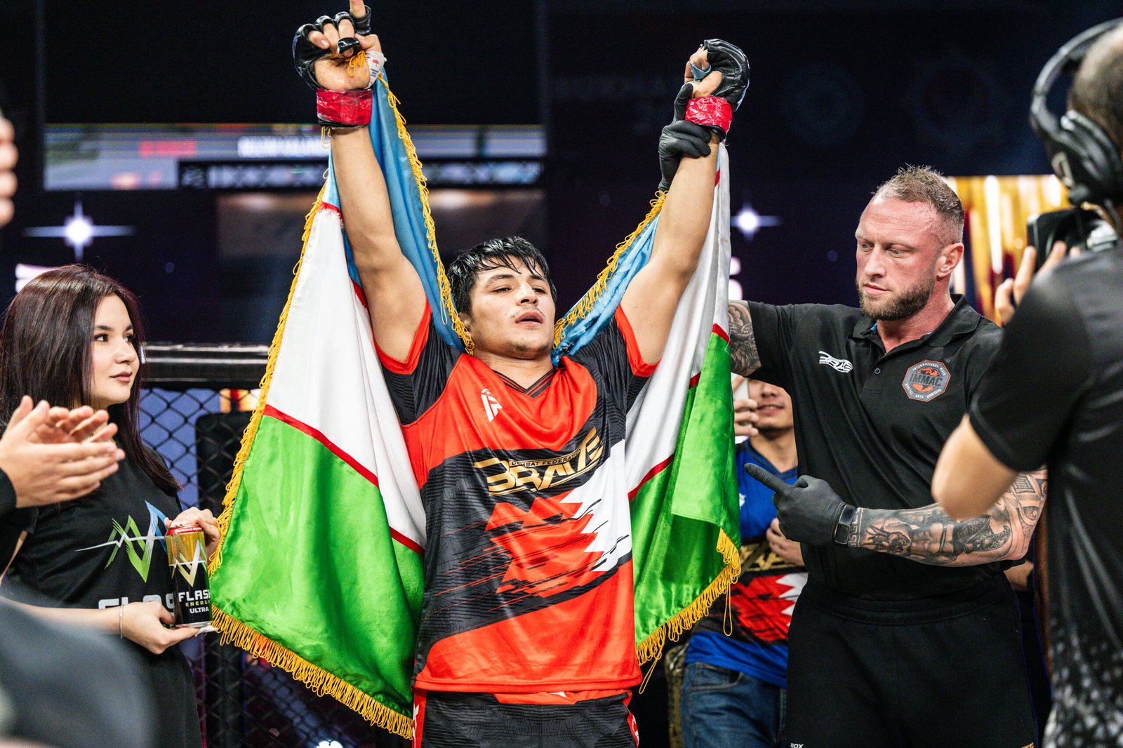 Nozim Kalandarov celebrates a unanimous decision victory over Rizwan Ali