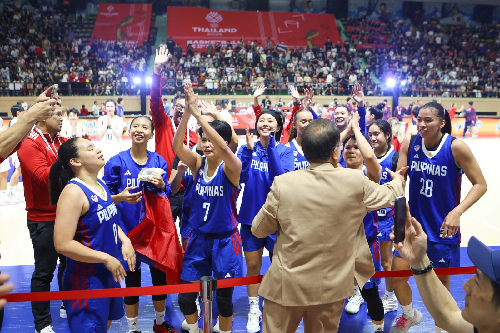 Gilas Pilipinas Women celebrate their 73-70 win at Nimibutr Stadium. [POC Media Pool]