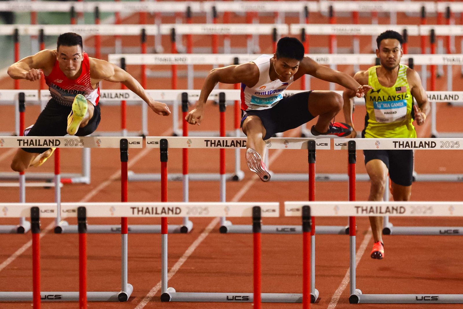 Tolentino clears the final hurdle en route to gold at the Supachalasai National Stadium. [POC Media Pool]