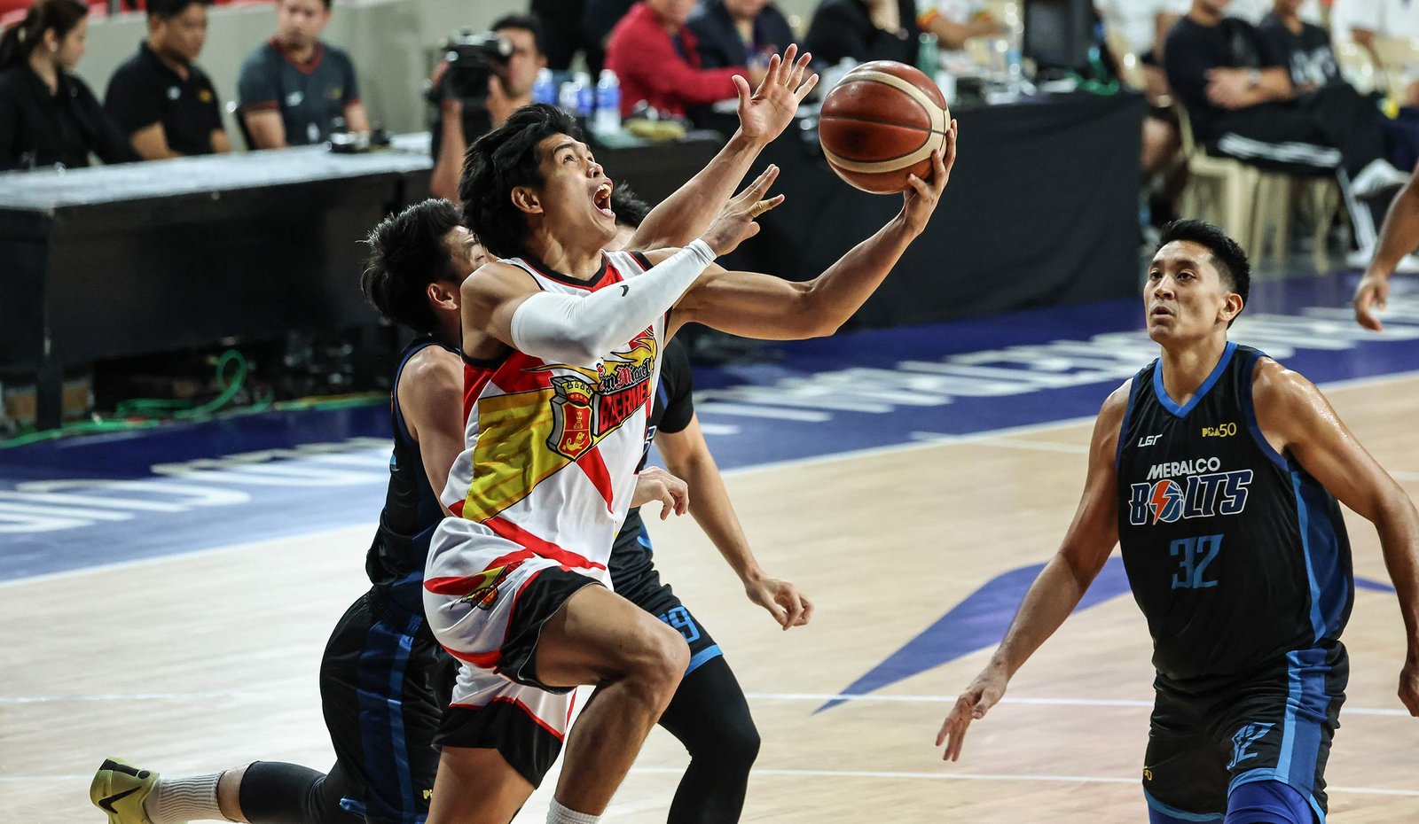 Don Trollano attacks the basket as San Miguel dominates Meralco. [PBA Images]