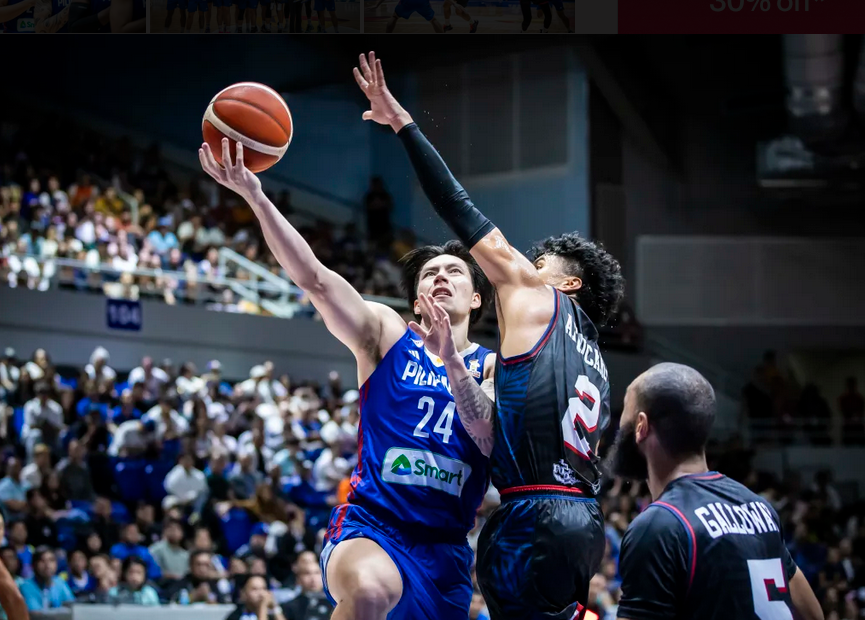 Dwight Ramos drives to the basket during Gilas Pilipinas’ 95-71 rout of Guam. [FIBA.com photo]