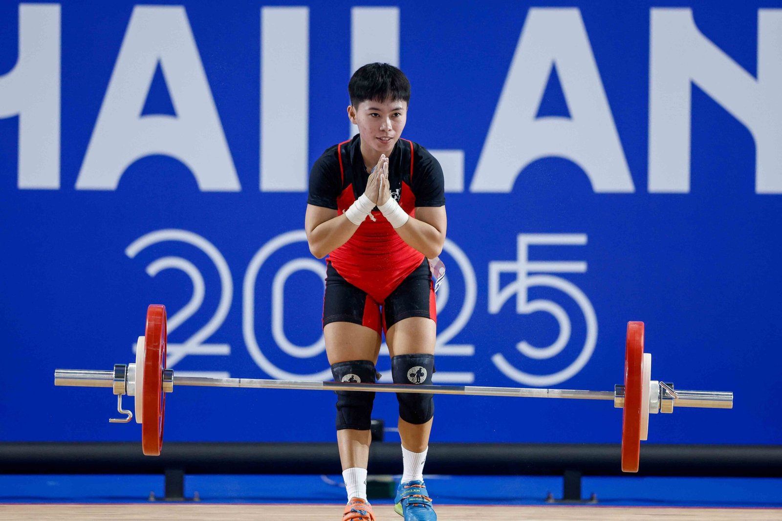 Rosegie Ramos reacts after failing to complete her lifts in the women’s 48kg at the SEA Games. [POC Media Pool]
