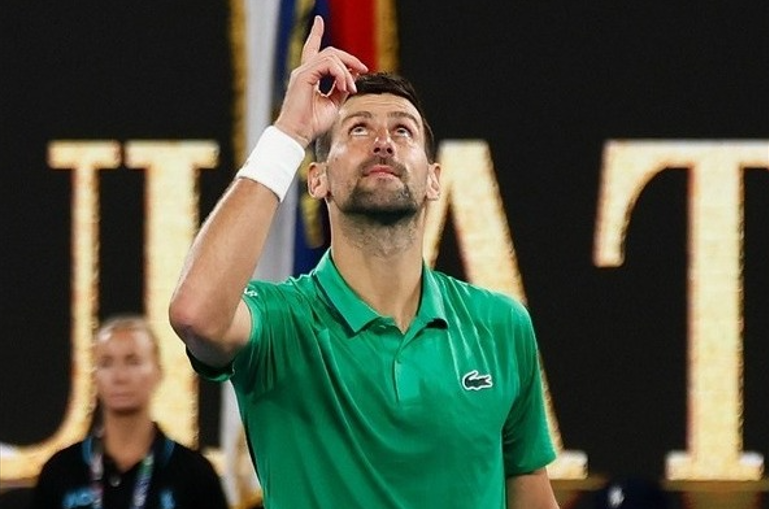 Djokovic reacts after securing his 100th career victory at the Australian Open. [photo credit: Australian Open Instagram]