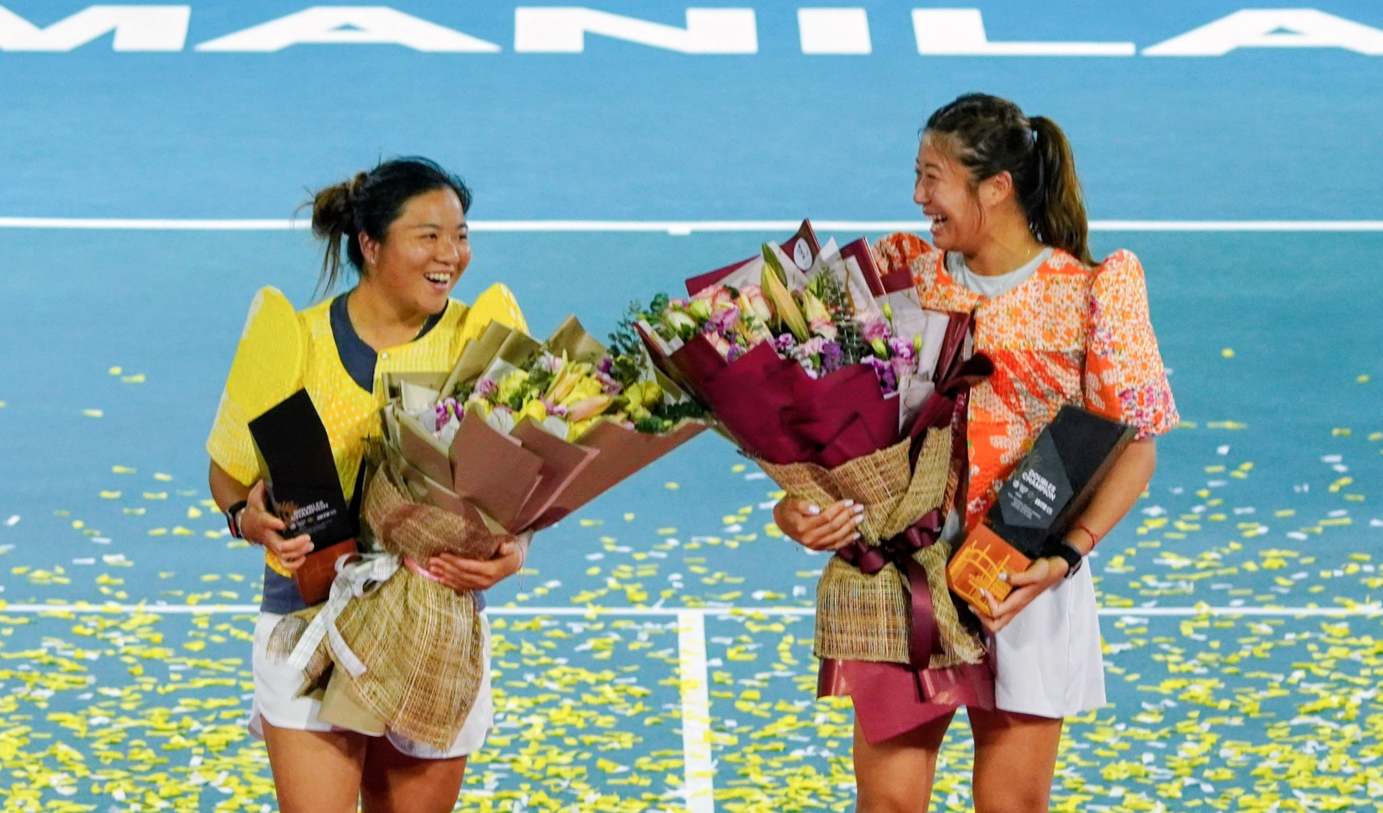 Hong Kong's Eudice Chong and Taiwanese Liang En-Shou pose with their championship tropy rallied from a 0-1 deficit to stun the top seeded American pair of Quinn Gleason and Sabrina Santamaria 2-6, 7-6 (7-2), 10-6 in securing the women's doubles championship. [photo credit: PHILTA/Philippine Women's Open ]