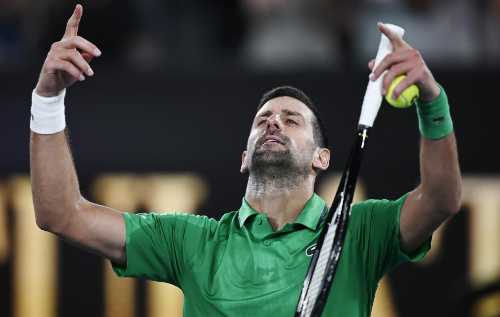 Djokovic acknowledges the crowd after recording his 400th grand slam match win. [photo credit: Xinhua]