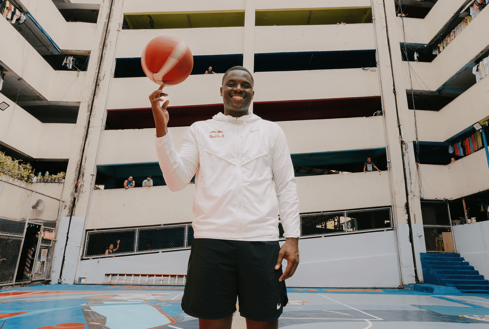 The Tenement basketball court hosts a landmark moment during Matthews’ visit. [photo credit: Red Bull]