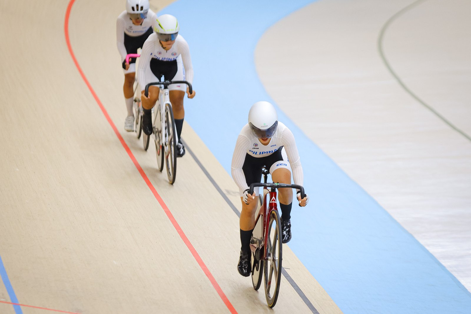 The Philippines’ Marlen Marasigan, Althea Campaña and Angelina Elvira compete in the women junior team elite race. [PhilCycling photo]