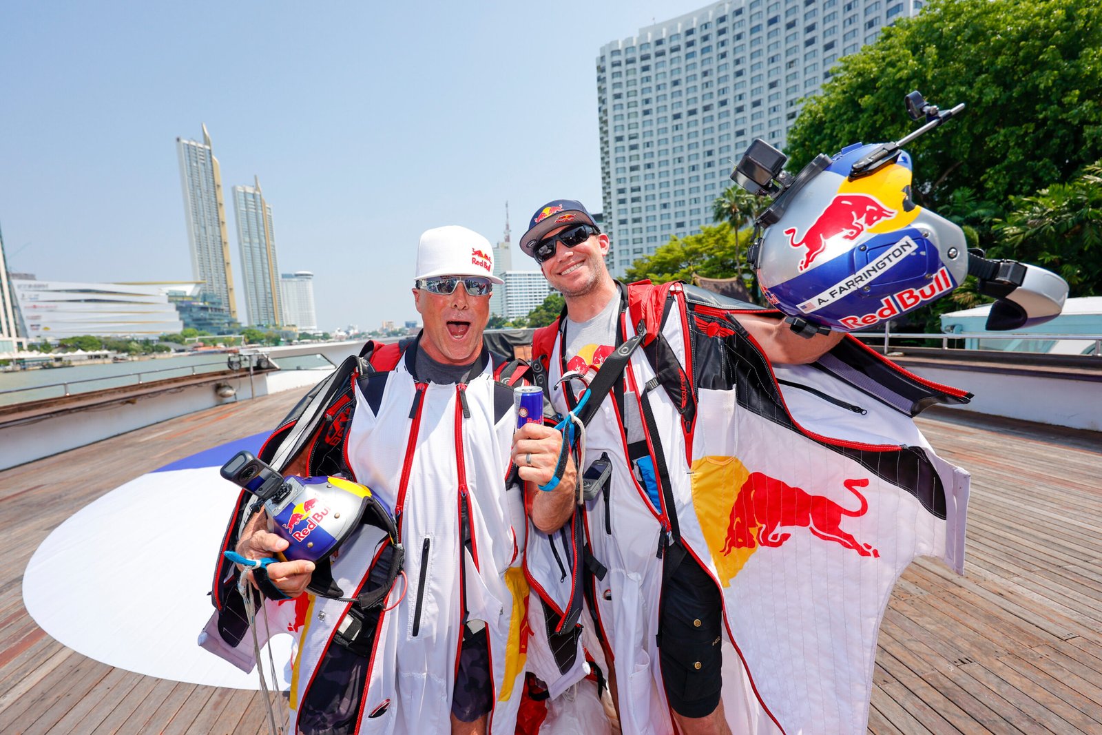 Miles Daisher (Left) and Andy Farrington celebrate the successful wingsuit above First-Ever Wingsuit Flight in BANGKOK, THAILAND [photo credit: Yosayoot Wiengviset / Red Bull Content Pool]