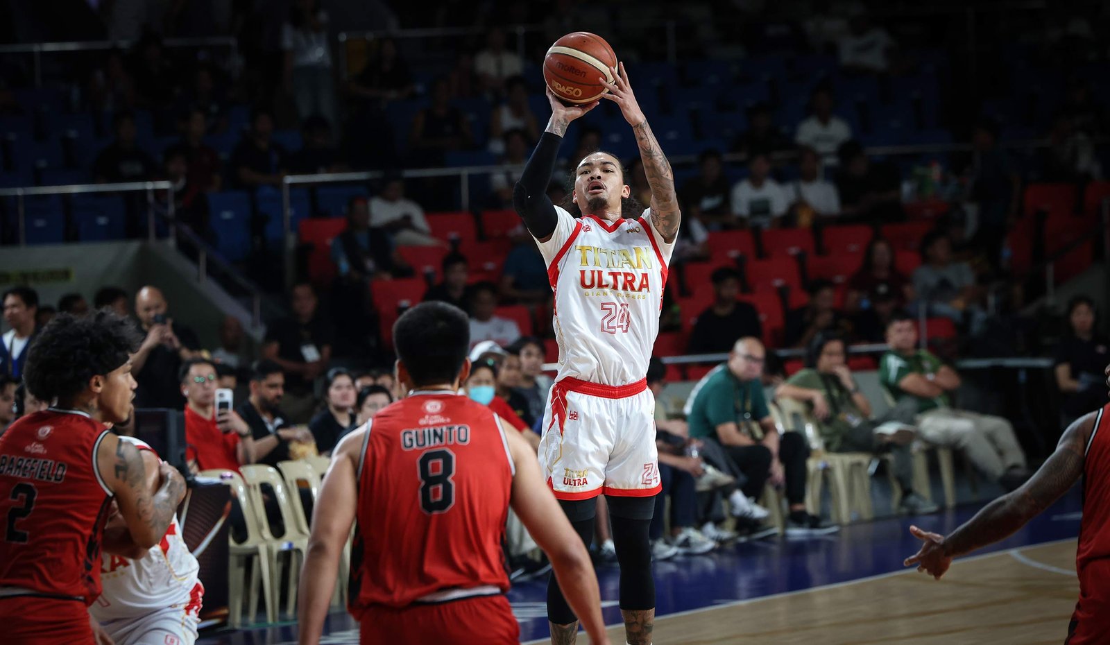 Joshua Munzon drills a clutch four-pointer to seal Titan’s win over Blackwater. [PBA Images]