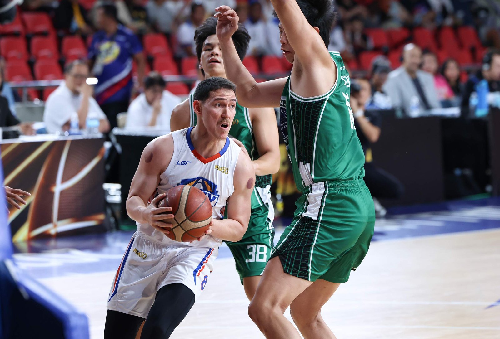Robert Bolick delivers in the clutch as NLEX survives Maverick Ahanmisi and Terrafirma to book a quarterfinals spot in the PBA Commissioner’s Cup. [PBA Images]