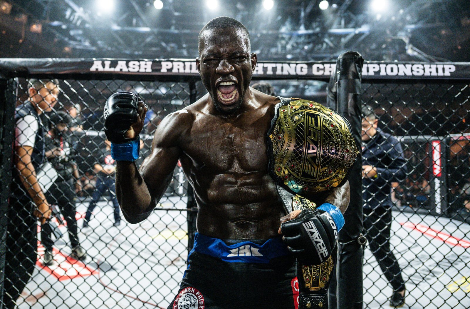 Nicholas Hwende celebrates after winning the BRAVE CF featherweight world championship in Almaty. [BRAVE CF photo]