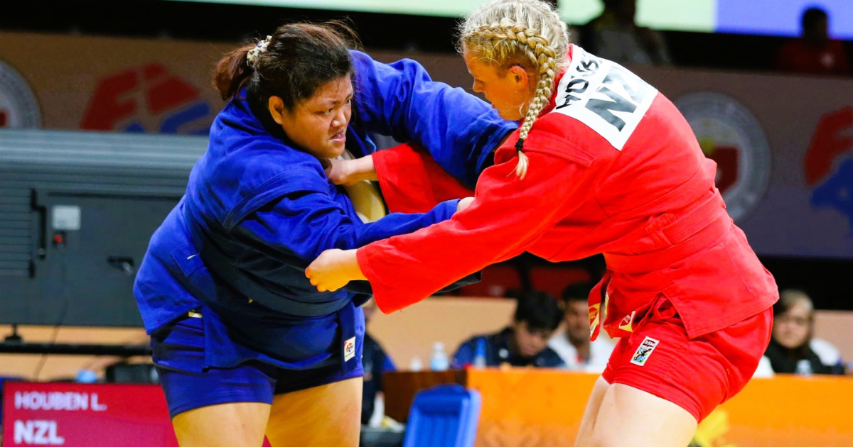 Defending champion Sydney Sy (left) grapples with New Zealand’s Lilly Houben in their women’s sport sambo +80kg semifinal match in the 11th Asia-Oceania Sambo Championships at the Ninoy Aquino Stadium