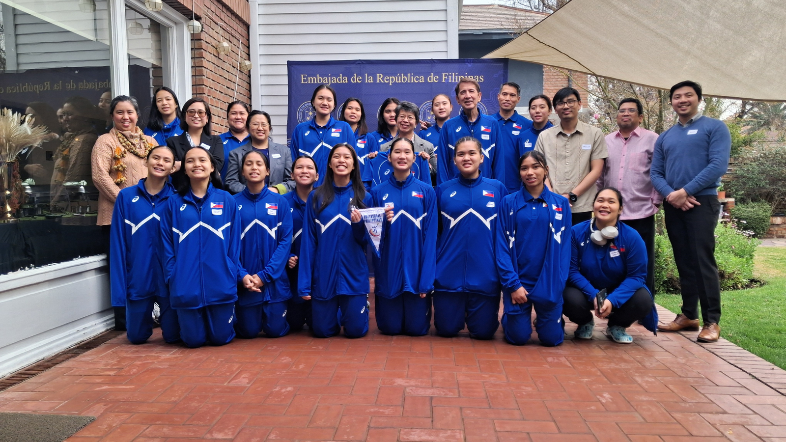 (Front) Jhenica Sadia, Resty Jane Olaguir, Taj Arkhea Teves, Frances Diane Ramos, Megan Yesha Hernandez, Sharina Rhyza Lleses, Cristina Madela Gale, Nadeth Faye Herbon, physiotherapist Hannah de Luna. (Rear) Jello Andrea Mauricio, mental performance coach Wynnette Bernardo, Princess Khaira Manzano, Irish May Mahinay, Jhaynna Love Bulandres, Ambassador Celeste Vinzon-Balatbat, Xyz Rayco, head coach Edwin Leyva, assistant coach Oliver Balse, Caera Celis with diplomatic staff at the Philippine embassy in Chile. [PSC photo]