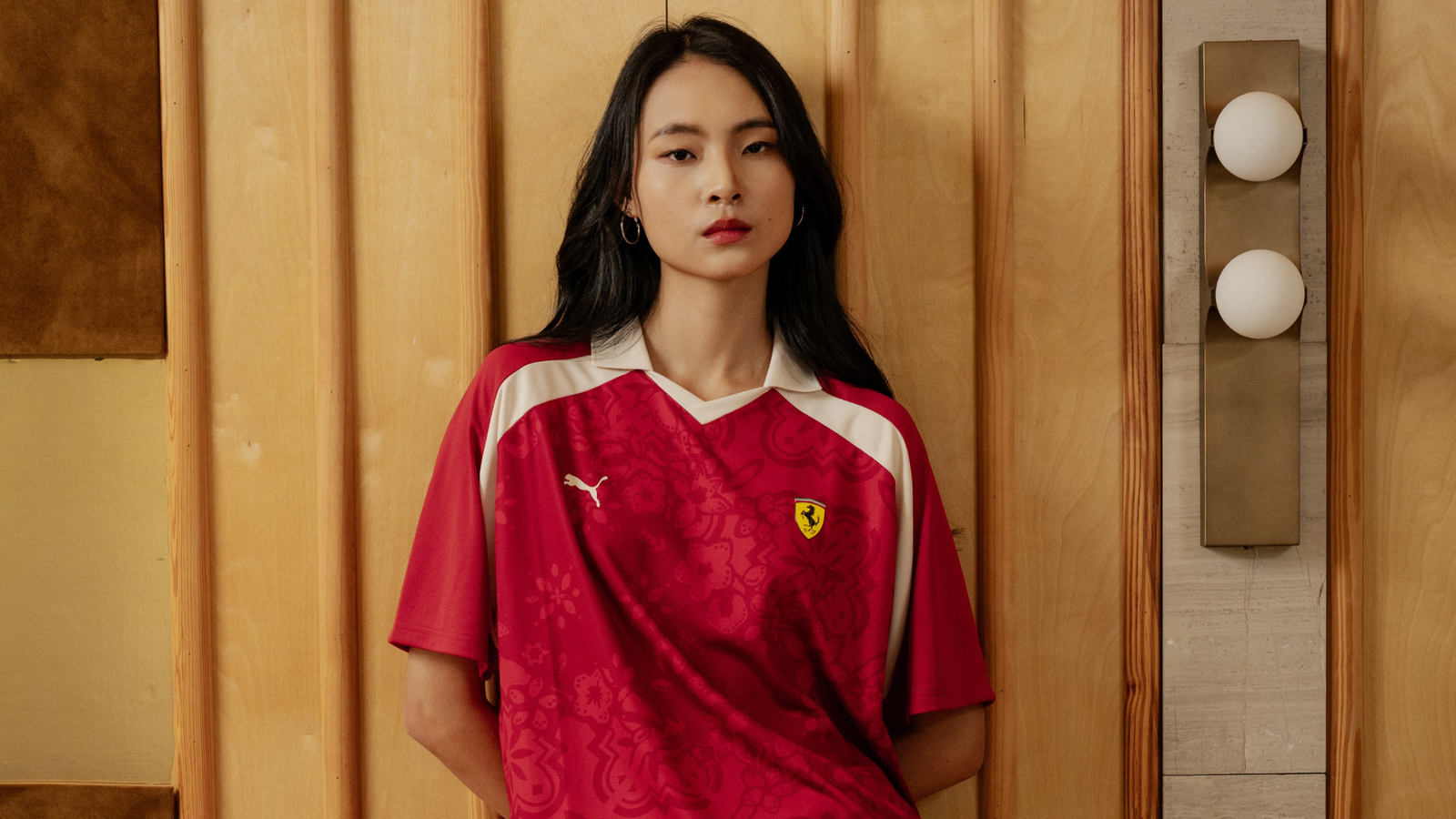 The Ferrari jersey combines Club Red and Shoji with heritage-inspired regional patterns.