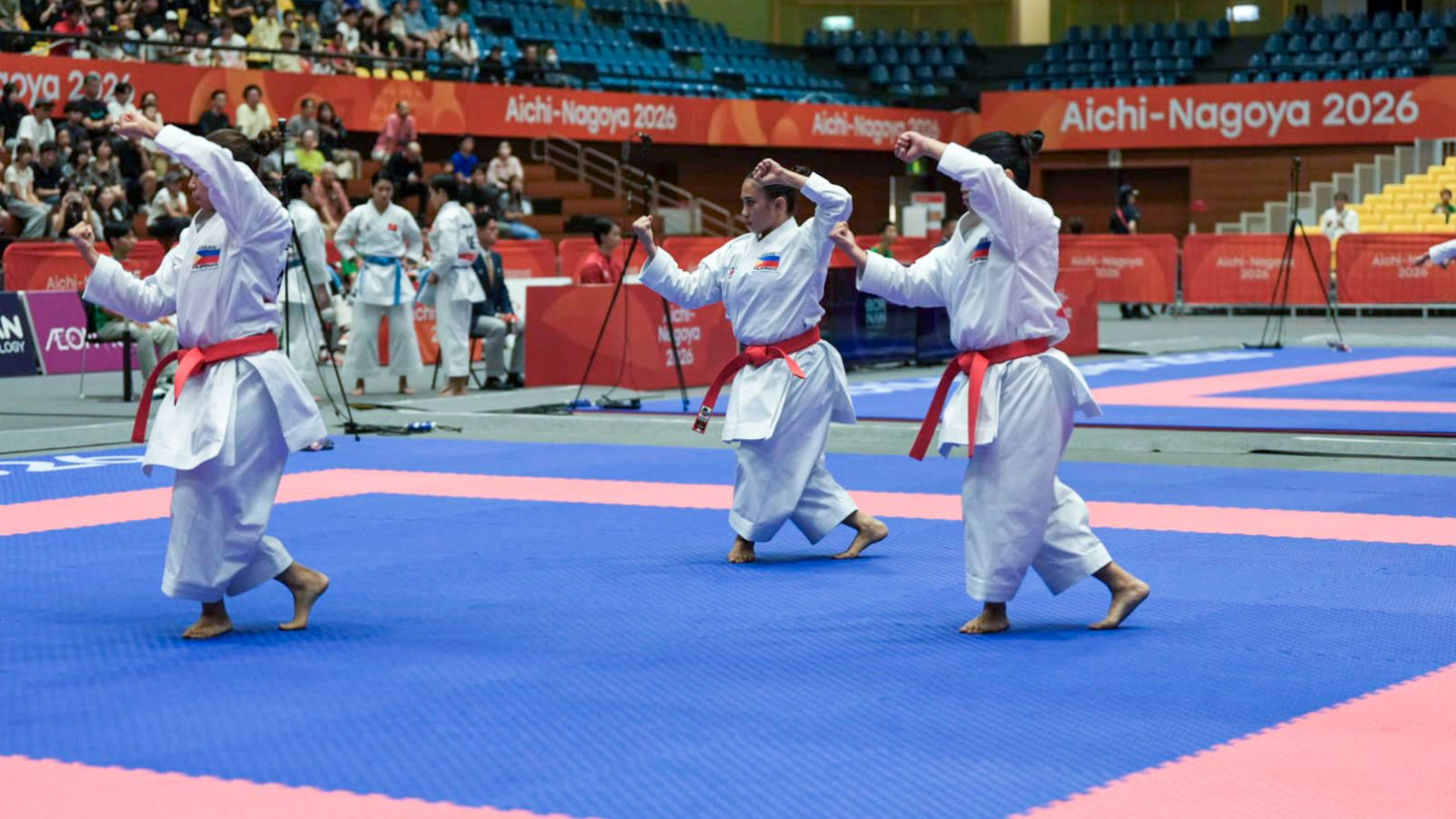 Rebecca Cyril Torres, Samantha Veguillas and Ysabelle Arrogante celebrate the Philippines' first Asian Games team kata bronze. [POC Media Pool]