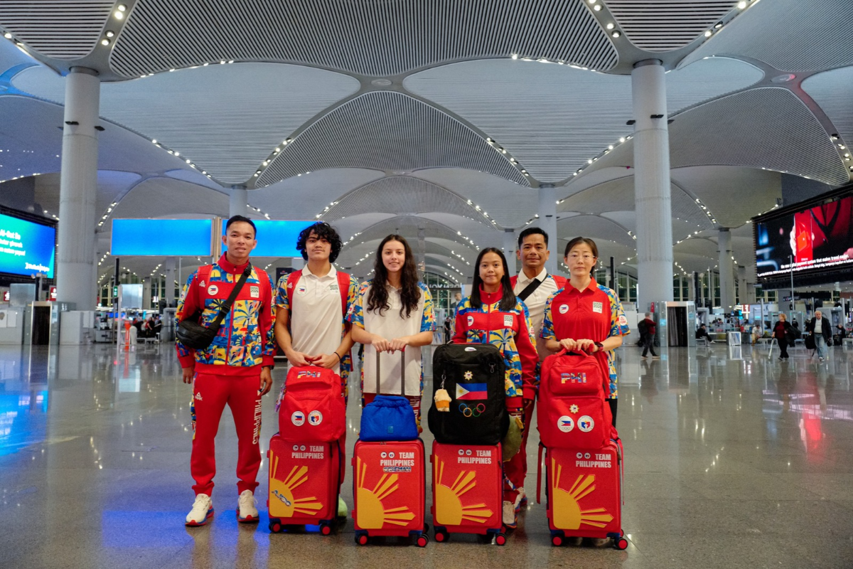 Team Philippines Travels to the Dakar Youth Olympic Games Swimmers Jamesray Michael Ajido and Riannah Chantelle Coleman, along with wushu athlete Angel Polo (second to fourth from left), pose with coaches Jensen Halili, Ramil Ilustre and Li Jianfang at Istanbul Airport. (POC Media Pool photo)